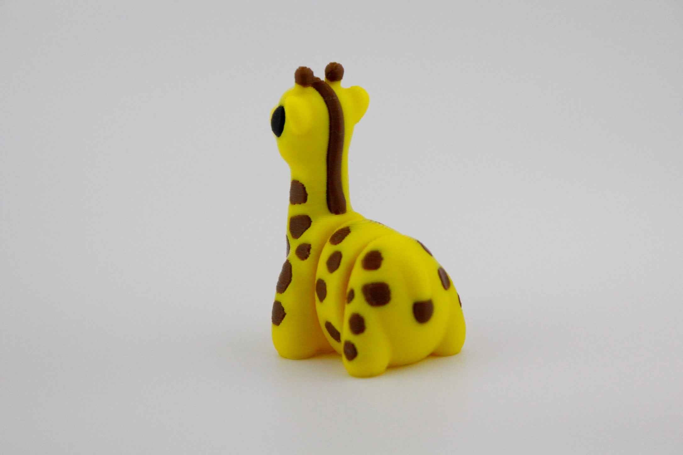 Giraffe Fidget - Stretching above the rest - Myth & Motion by The Braysdown Workshop